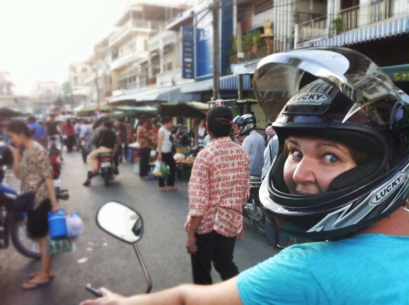 Marcie about to take off on her moto into a crowded street! 